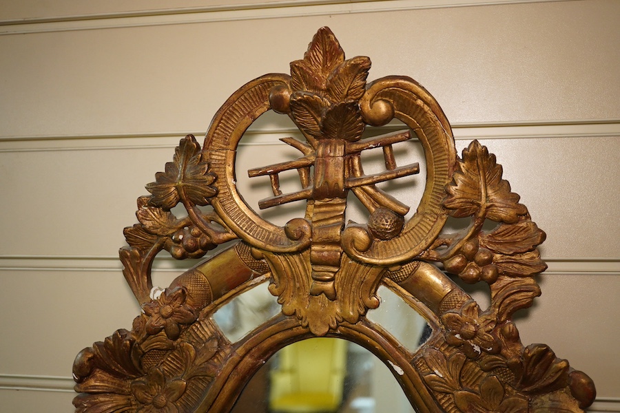 A Victorian gilt gesso mirror with chimney sweep's guild crest. Condition - poor to fair